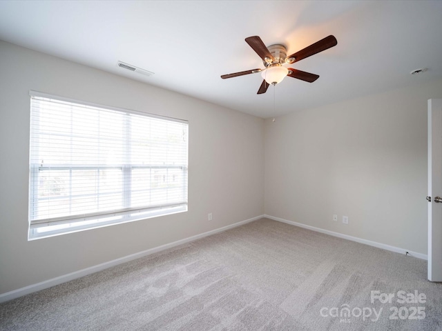 carpeted empty room with ceiling fan