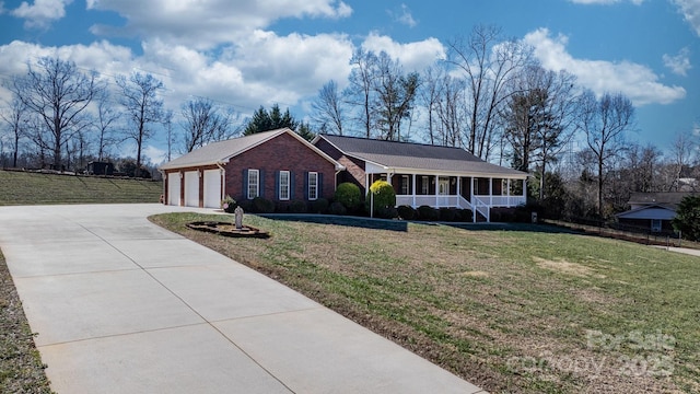 single story home with a garage, a front lawn, and a porch