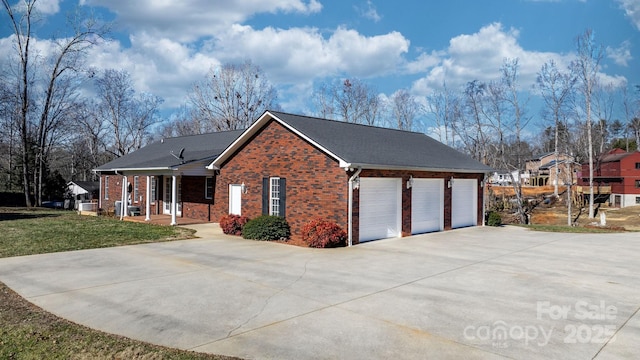 view of side of property with a porch and a yard