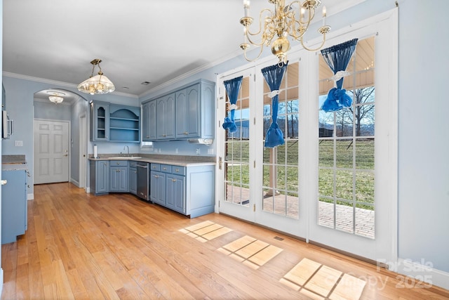 kitchen featuring blue cabinets, sink, hanging light fixtures, ornamental molding, and light hardwood / wood-style floors