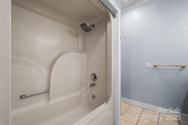 bathroom featuring tile patterned flooring and bathing tub / shower combination