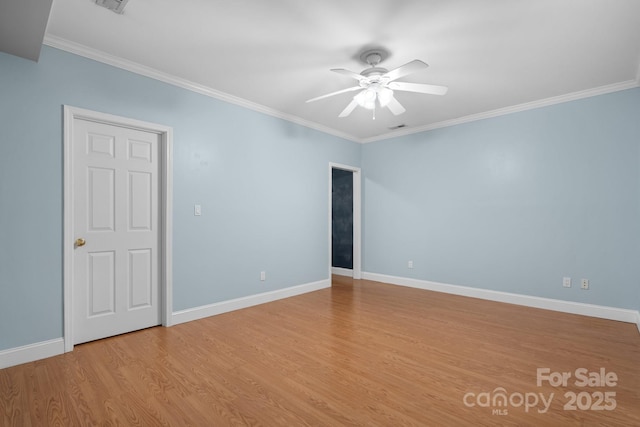 empty room featuring ornamental molding, light hardwood / wood-style floors, and ceiling fan