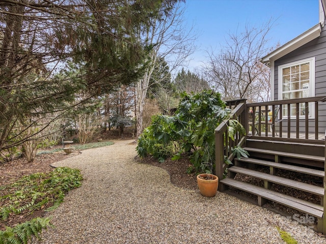 view of yard with a wooden deck