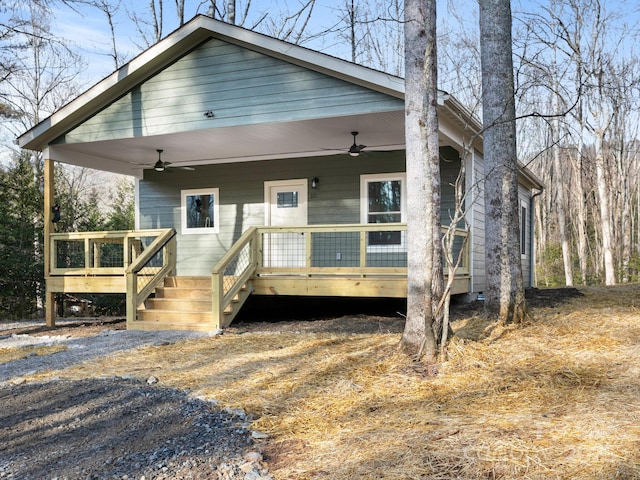 bungalow featuring ceiling fan and a deck