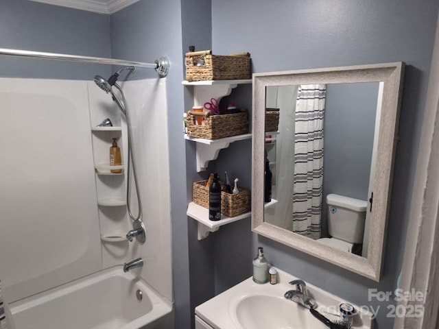 full bathroom featuring vanity, ornamental molding, bathtub / shower combination, and toilet