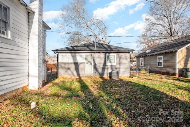 exterior space with an outdoor structure and a yard