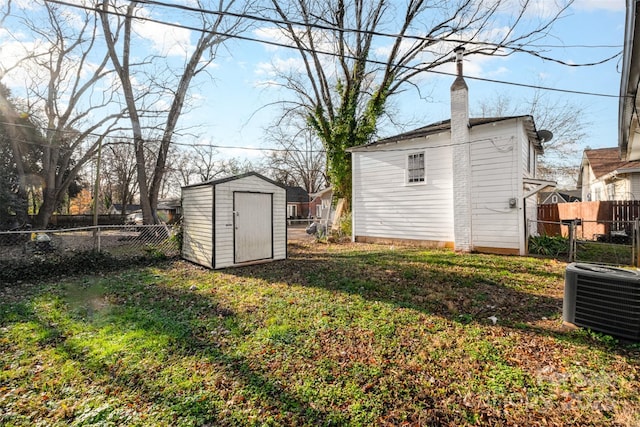 view of yard with a storage shed and cooling unit