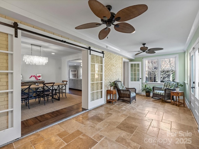 sunroom / solarium with a barn door