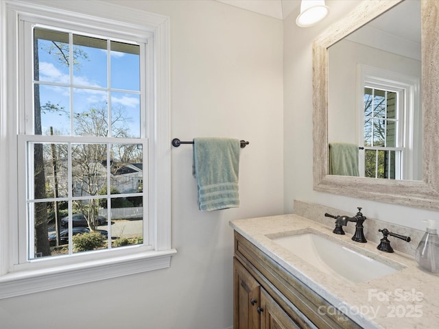 bathroom featuring plenty of natural light and vanity