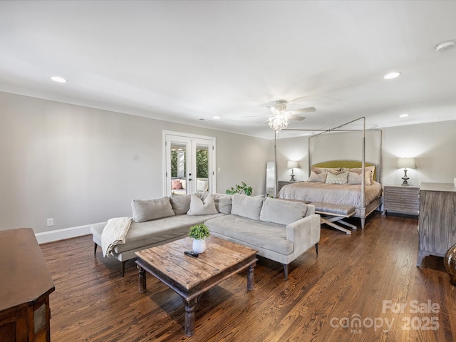 bedroom featuring ornamental molding, dark hardwood / wood-style flooring, ceiling fan, and french doors