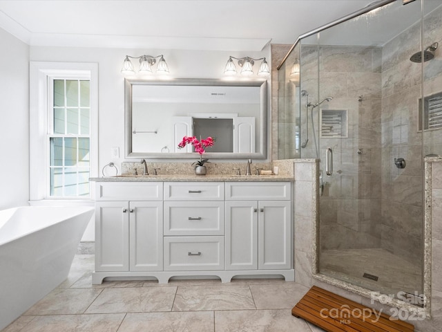 bathroom featuring separate shower and tub and vanity