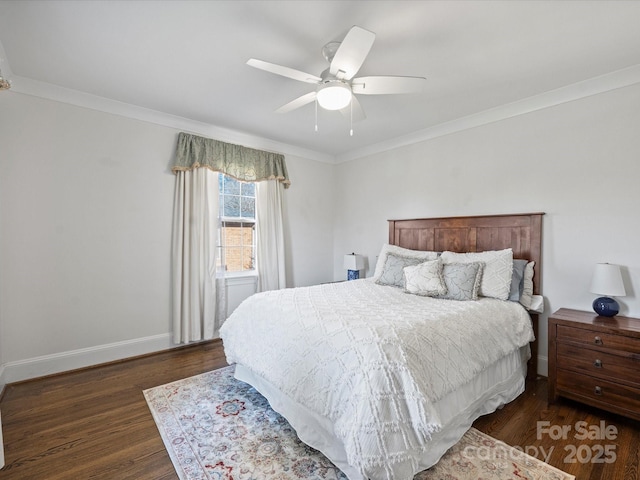 bedroom with ceiling fan, ornamental molding, and dark wood-type flooring