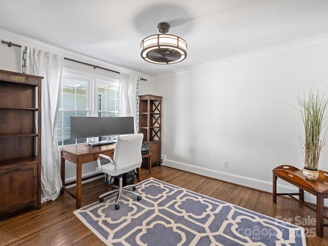 office with dark hardwood / wood-style floors and crown molding