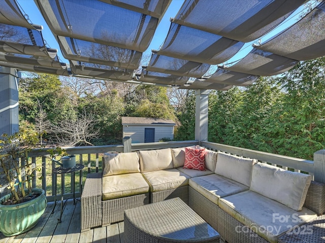 wooden deck with outdoor lounge area, a storage shed, and a pergola