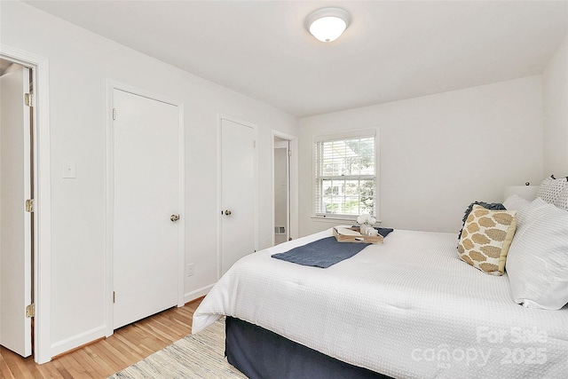 bedroom with light wood-style flooring