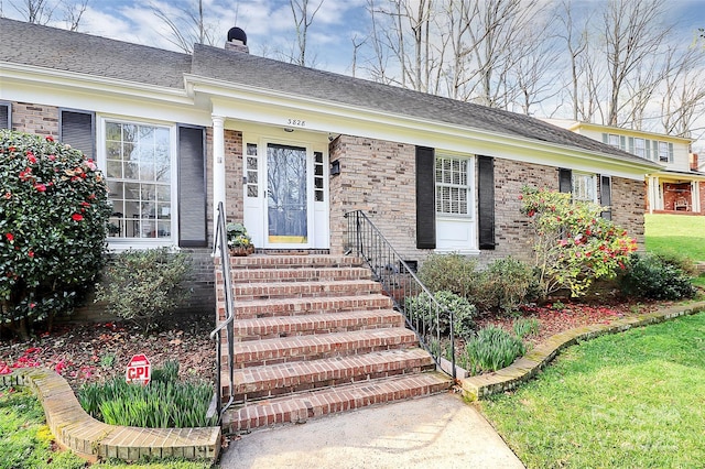 3828 Chandworth Rd, Charlotte, NC 28210 - entrance to property with brick siding, a chimney, and a shingled roof