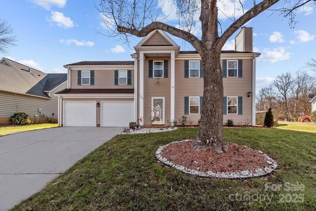 view of front of property featuring a garage and a front lawn