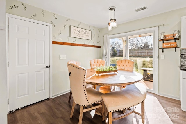 dining room featuring dark wood-type flooring