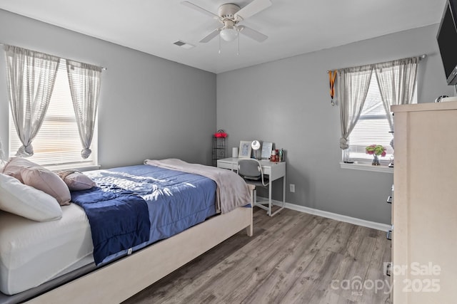 bedroom featuring wood-type flooring and ceiling fan