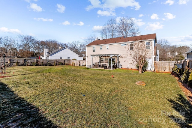 rear view of property featuring a yard, a patio area, and a pergola