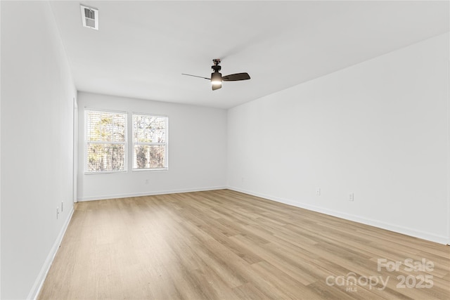 empty room featuring light wood-type flooring and ceiling fan