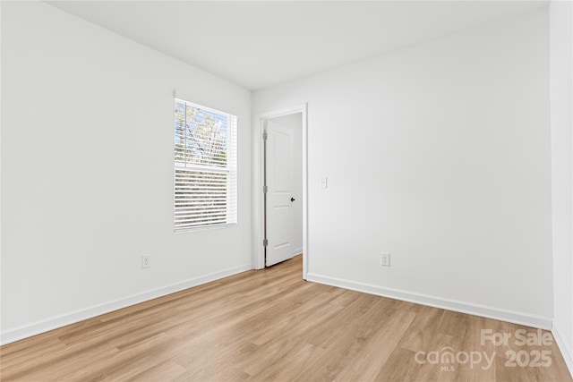 unfurnished room with light hardwood / wood-style floors