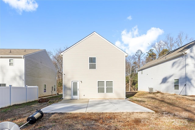 back of property featuring a patio area and central AC