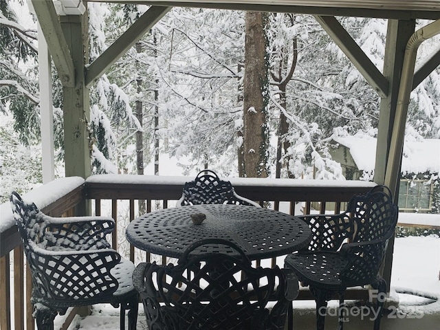 view of snow covered deck