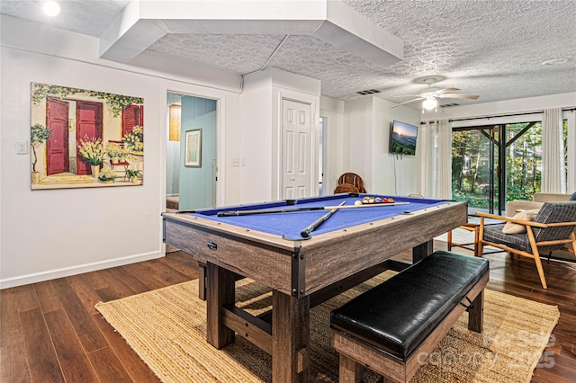 game room with dark wood-style flooring, baseboards, ceiling fan, a textured ceiling, and pool table