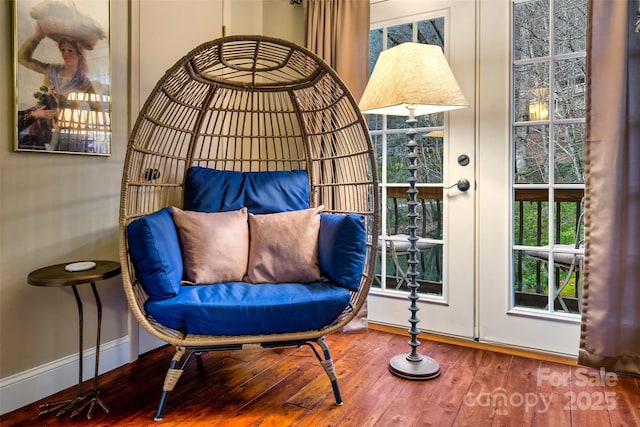 interior space featuring baseboards and hardwood / wood-style flooring