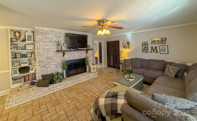 living area with a brick fireplace, crown molding, baseboards, and ceiling fan