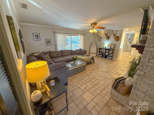 living room with a ceiling fan, visible vents, and crown molding