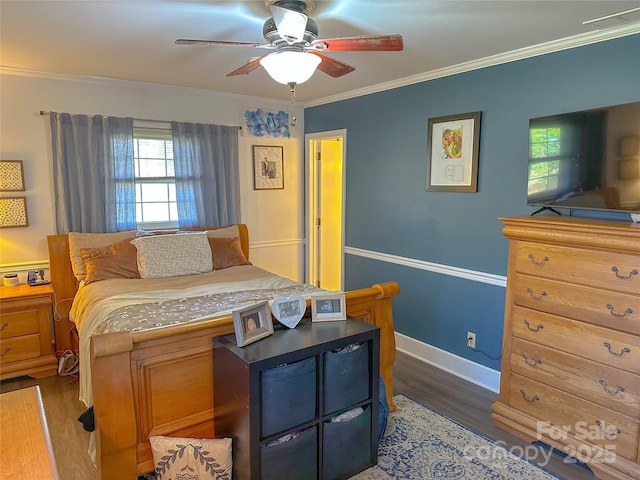 bedroom featuring baseboards, visible vents, ceiling fan, dark wood-style flooring, and crown molding