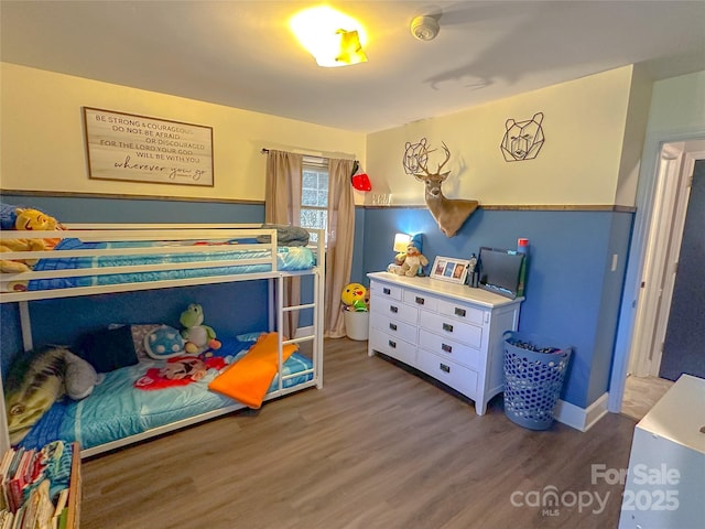 bedroom with wood finished floors