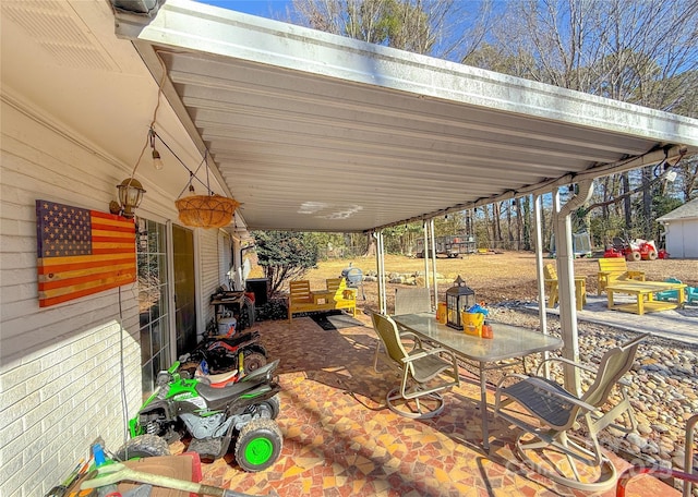 view of patio featuring a carport