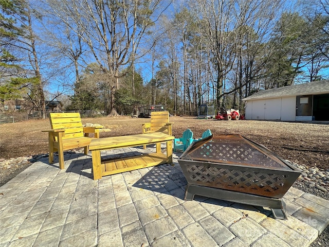 view of patio / terrace with an outdoor fire pit