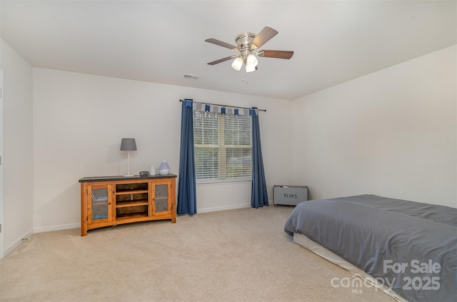 carpeted bedroom featuring ceiling fan