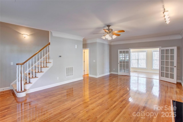 unfurnished living room with ceiling fan, wood-type flooring, and crown molding