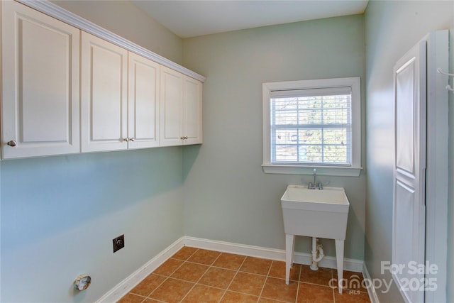 washroom with cabinets and light tile patterned floors