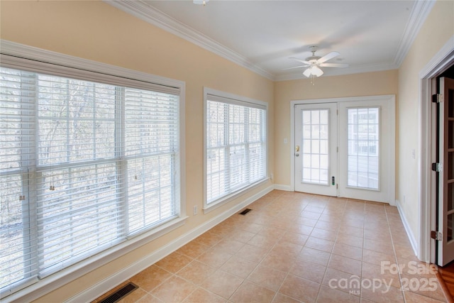 unfurnished sunroom with ceiling fan and plenty of natural light