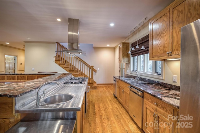 kitchen featuring light hardwood / wood-style floors, sink, appliances with stainless steel finishes, and island range hood