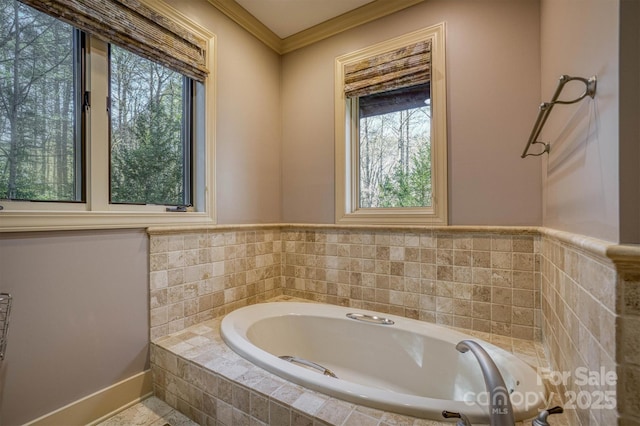 bathroom featuring tiled bath and ornamental molding