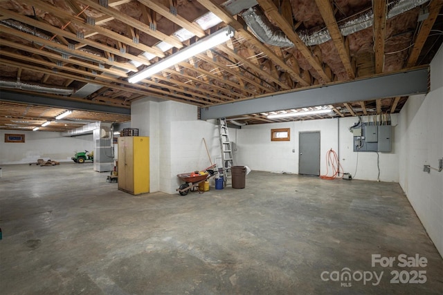 basement with electric panel and heating unit