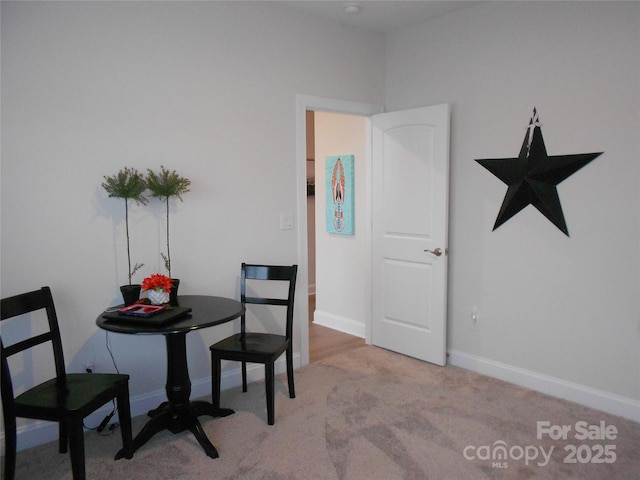 dining room with carpet and baseboards