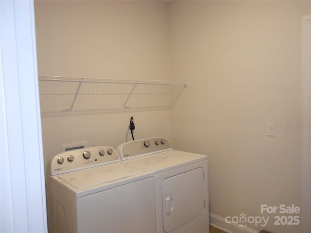 laundry room with washing machine and dryer and laundry area