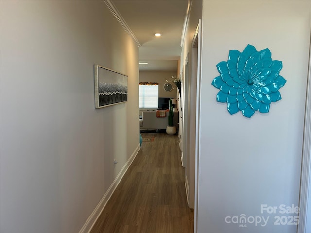 hall featuring baseboards, dark wood-style flooring, crown molding, and recessed lighting