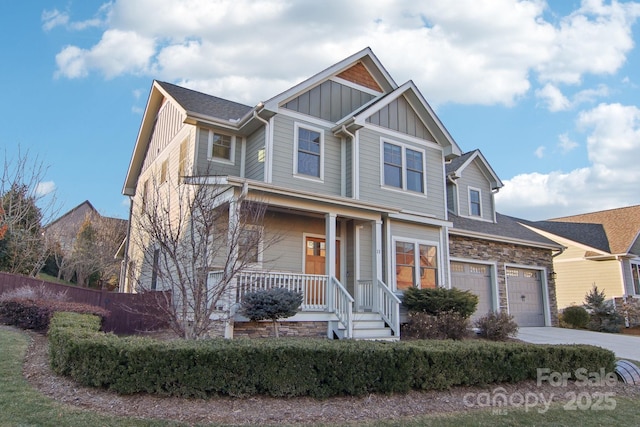 view of front of property featuring a garage and covered porch