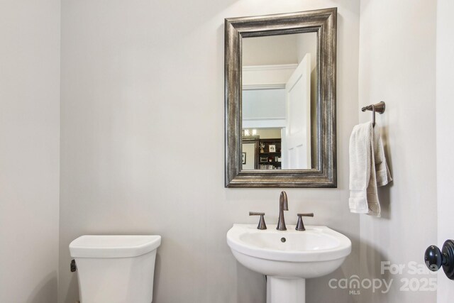 bathroom with sink and toilet