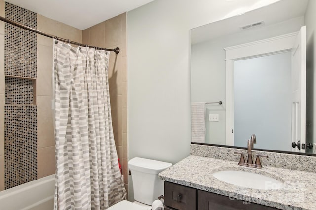 full bathroom with vanity, toilet, and shower / bath combo with shower curtain