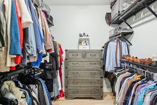 walk in closet featuring light hardwood / wood-style floors